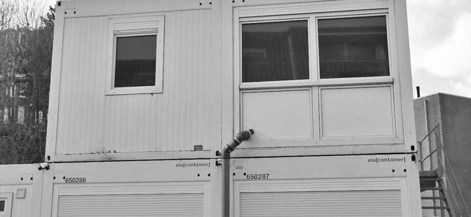 A modular portable building with two levels.